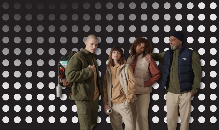 A group of adults model the Stanley/Stella AW24 range, against a grey-spotted background