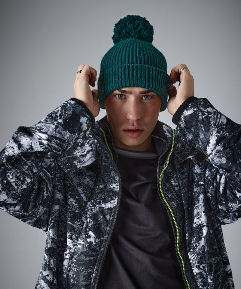 Engineered knit ribbed pom pom beanie